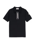 Polo nera con dettaglio gommato logo Moncler
