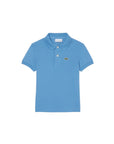 Polo azzurra con patch logo Lacoste