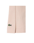 Gonna beige con plisse e logo Lacoste cucito frontale