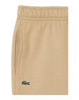 Pantalone in felpa beige con patch logo Lacoste