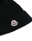 Cappello nero con pompom e patch logo Moncler