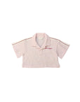 Polo cropped rosa con stampa logo Palm Angels