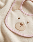 Bavaglio bianco con dettagli rosa e logo Le Bebé cucito frontale