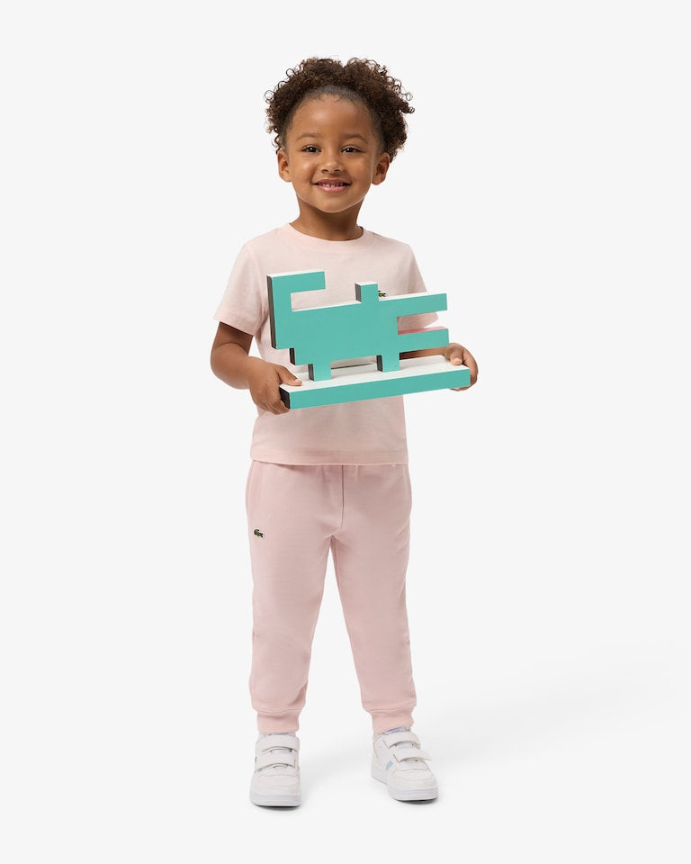Pantalone in felpa rosa con patch logo Lacoste