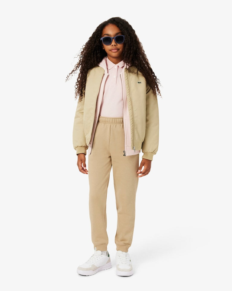 Pantalone in felpa beige con patch logo Lacoste