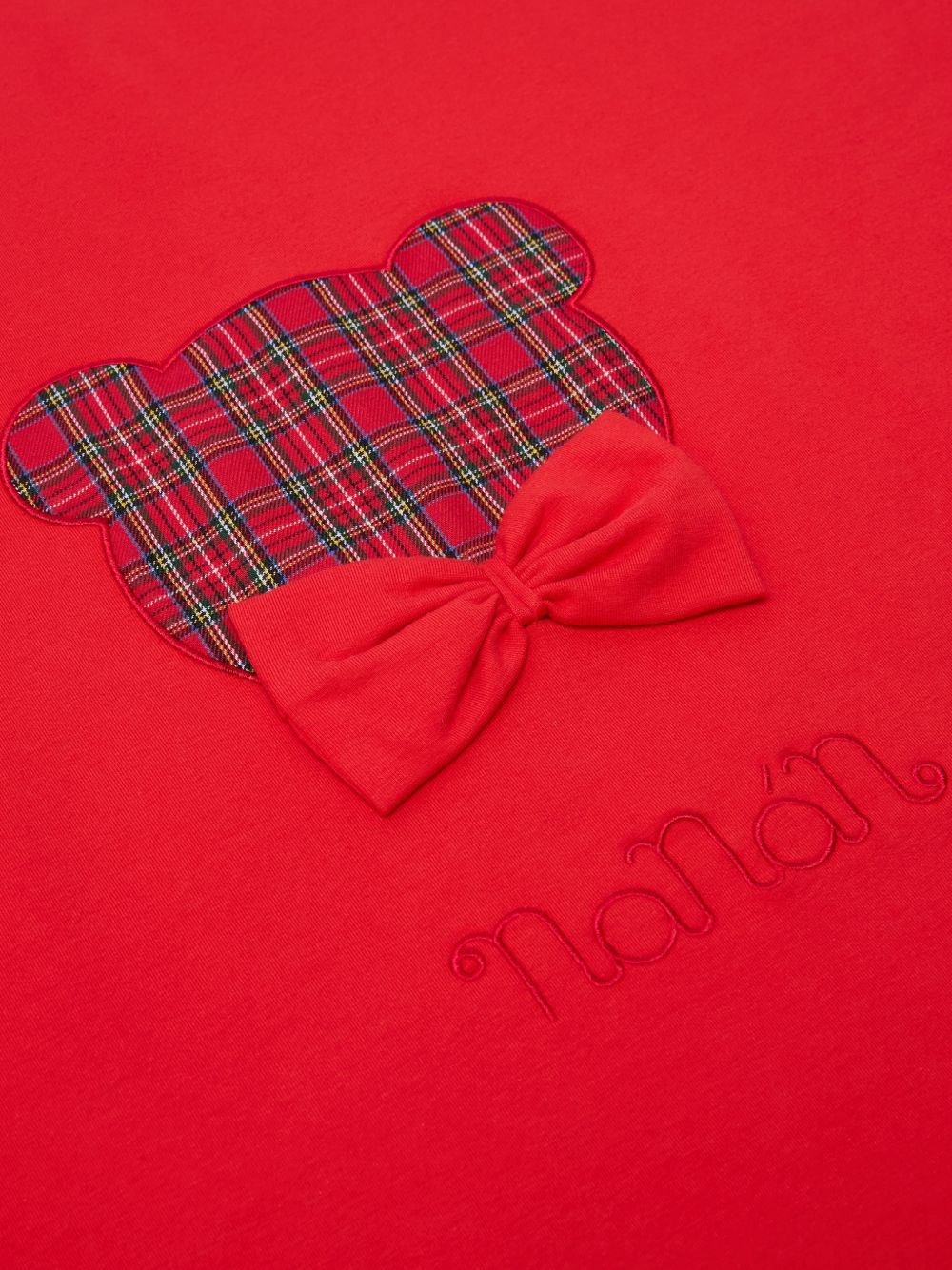 Coperta in cotone rossa con logo Nanan e fiocco cucito frontale rosso