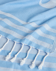 Telo mare azzurro con dettaglio logo Sundek