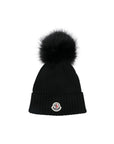 Cappello nero con pompom e patch logo Moncler