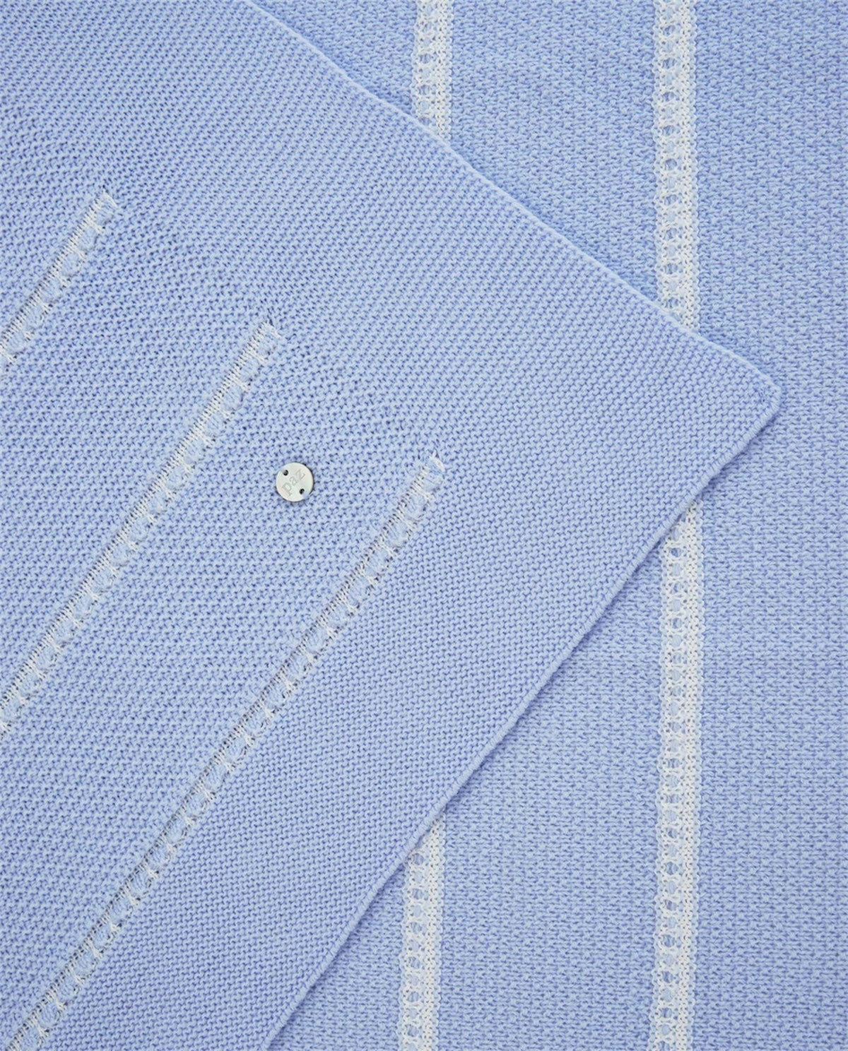 Coperta azzurra con dettagli logo Paz Rodriguez frontali